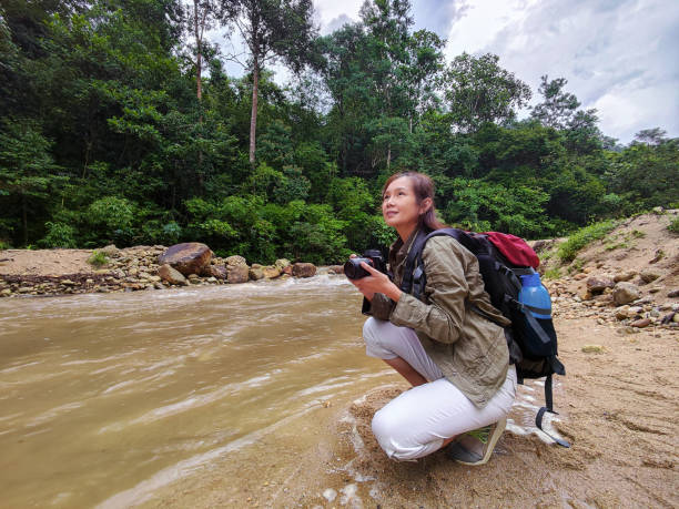 istock Travel explorer having camera for capturing beautiful view. 1402414300
