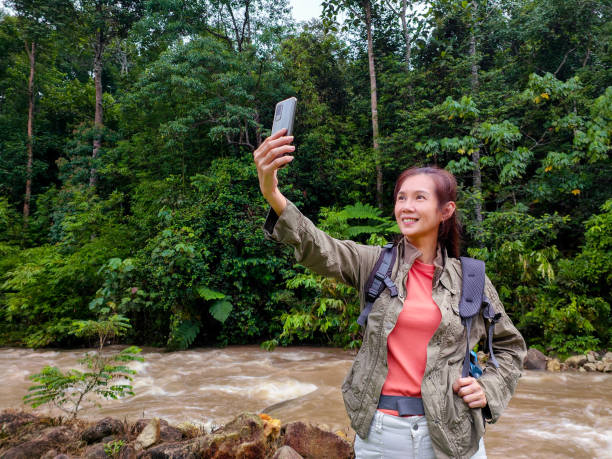 istock Hiker female take selfie beside river 1402414370