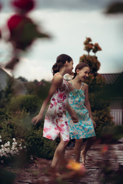 istock Children walk in the summer garden. 1402425527
