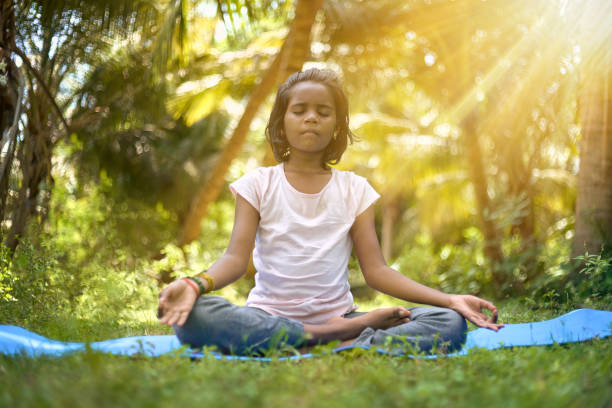 istock Asian girl meditating - practicing yoga 1402428918