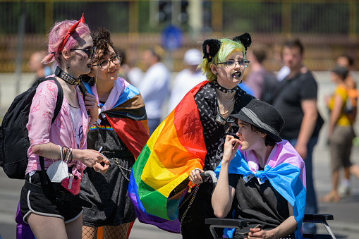 Vienna, Austria - June 11, 2022: People at Vienna Pride on Wiener Ringstrasse, girls with flag