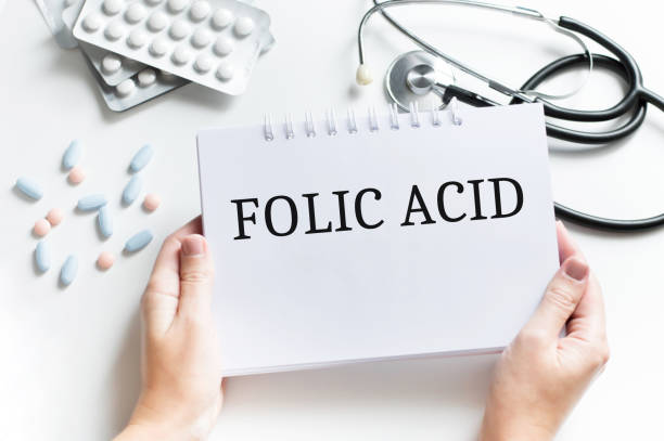 văn bản folic acid trên sổ ghi chép trên bàn bác sĩ, khái niệm y tế - acid folic hình ảnh sẵn có, bức ảnh & hình ảnh trả phí bản quyền một lần