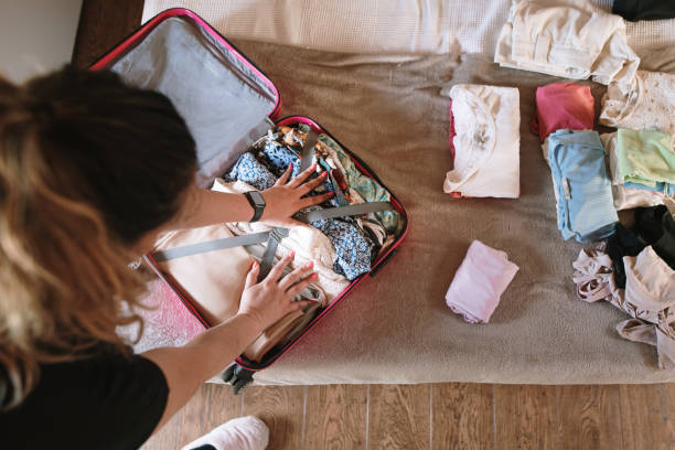 istock Woman preparing a suitcase 1402435866