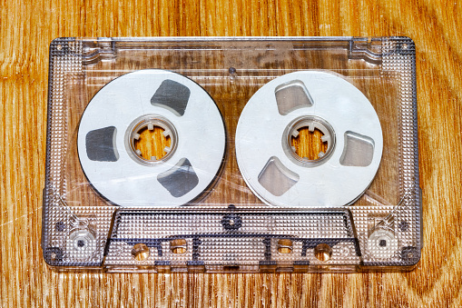 Audio cassette - wooden background