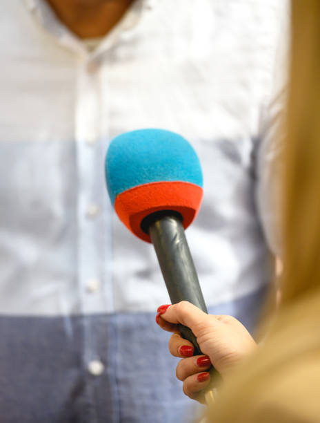 istock Female journalist interviewing a celebrity 1402440093
