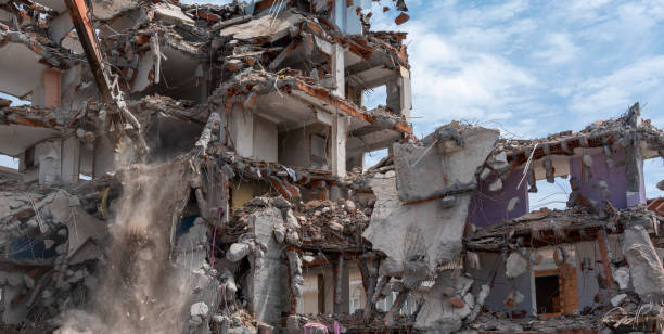 istock Building House Demolition site Excavator with hydraulic crasher machine and yellow container 1402441937