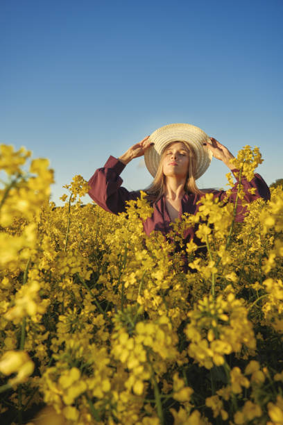 istock woman in a blooming field 1402442172