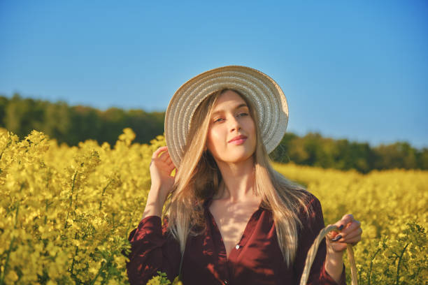 istock woman in a blooming field 1402442198