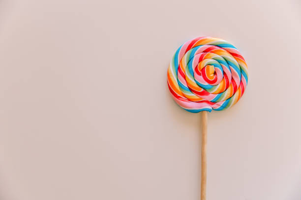 istock Multicolored lollipop close-up on a white background 1402442201