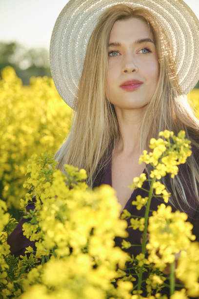 istock woman in a blooming field 1402442206