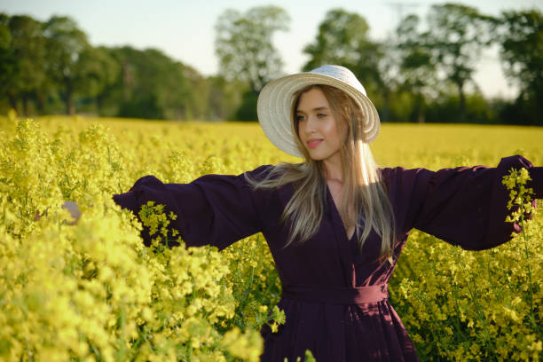 istock woman in a blooming field 1402442230