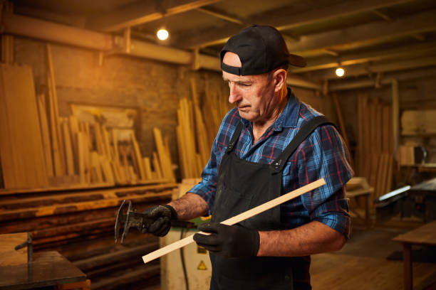 istock Senior professional carpenter working with caliper in the carpentry workshop 1402448867