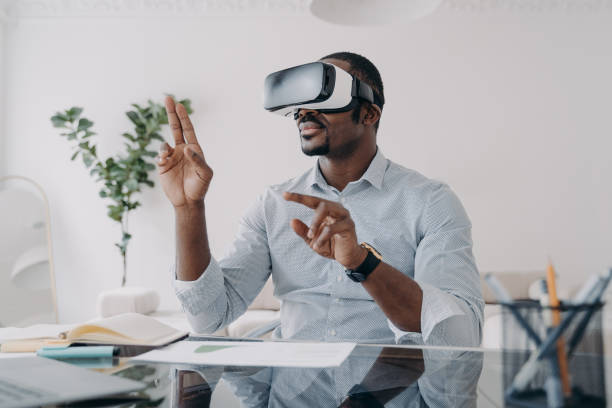 istock Businessman in vr headset clicks virtual buttons. Modern technology for business and creativity. 1402449182