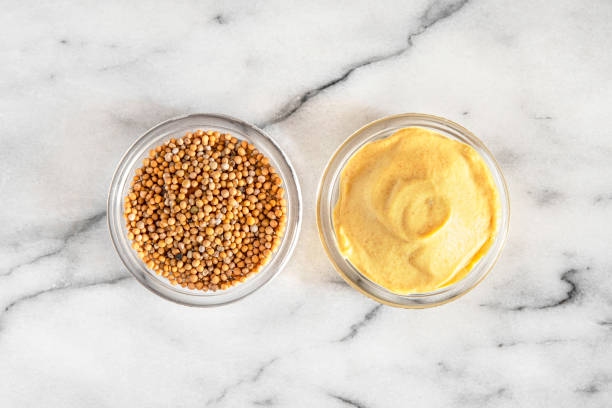 istock Close-up of mustard seeds and mustard 1402453600