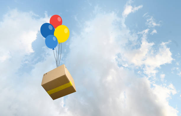 istock Parcel box delivered by colored baloons in the sky 1402453874