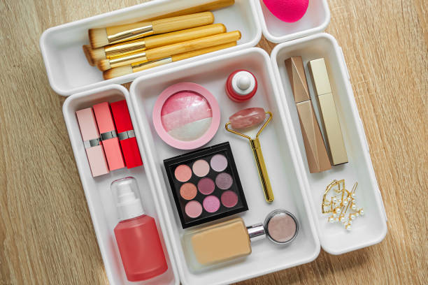 istock Cosmetics products arranged in white organizers. Creative Drawer Organizing. Storage beauty products and accessories. 1402454237