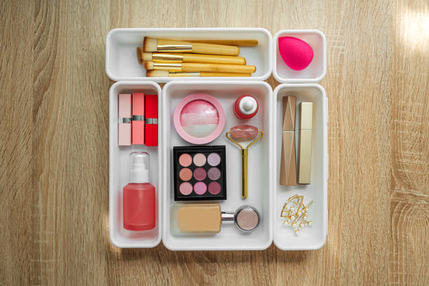 istock Cosmetics products arranged in white organizers. Creative Drawer Organizing. Storage beauty products and accessories. 1402454238
