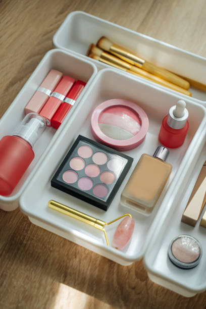 istock Cosmetics products arranged in white organizers. Creative Drawer Organizing. Storage beauty products and accessories. 1402454241