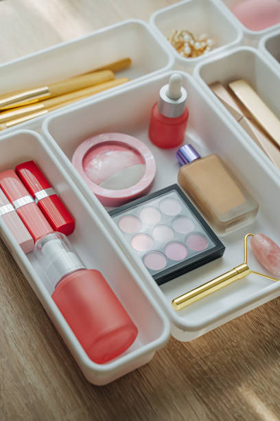 istock Cosmetics products arranged in white organizers. Creative Drawer Organizing. Storage beauty products and accessories. 1402454248