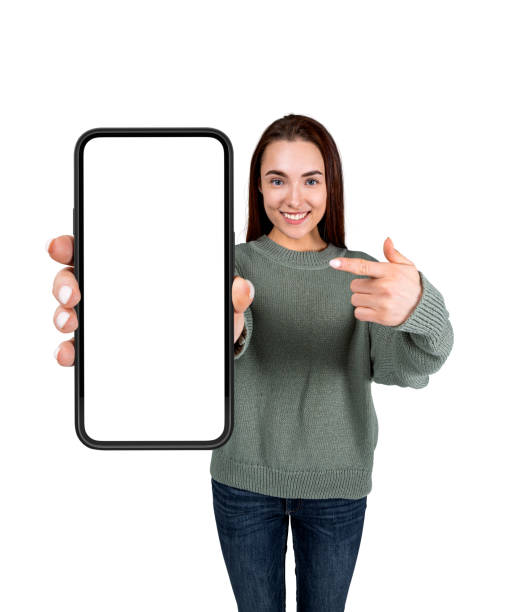 istock Woman pointing at phone mockup display isolated over white backg 1402455811