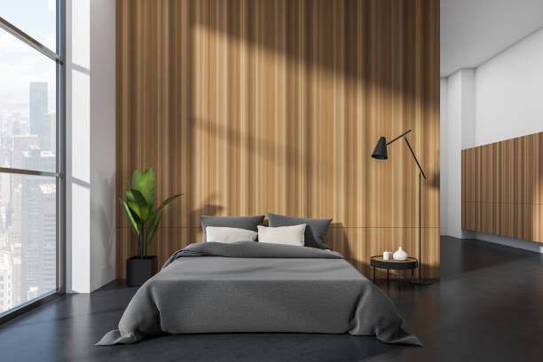 istock Front view on bright bedroom interior with empty wooden wall 1402456768