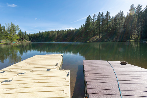 Wooden pier lying on lake Kaniere, South Island, New Zealand.