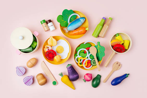istock Plates with breakfast, lunch and dinner. Wooden fruit and vegetables play set.  Game for learning and development of the child. Cute wooden kids toys to play in the kitchen 1402457032