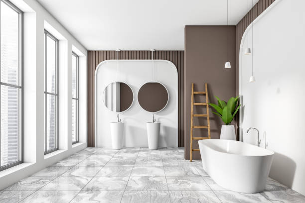 istock Light bathroom interior with bathtub, sink and window with city view 1402457832
