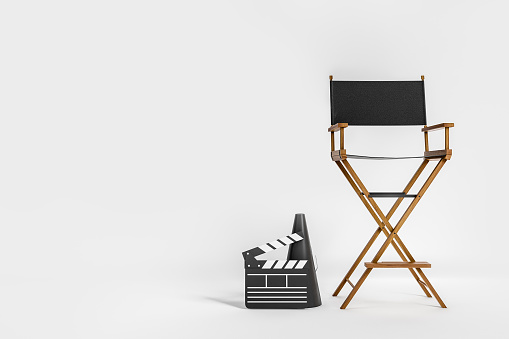 Film production, director's chair and clapper with megaphone on light background. Concept of cinema. Mockup copy space, 3D rendering