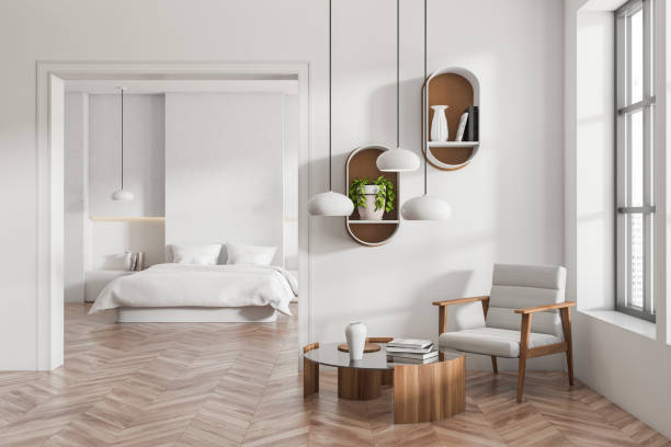 istock Front view on bright bedroom and living interior with bed 1402458030