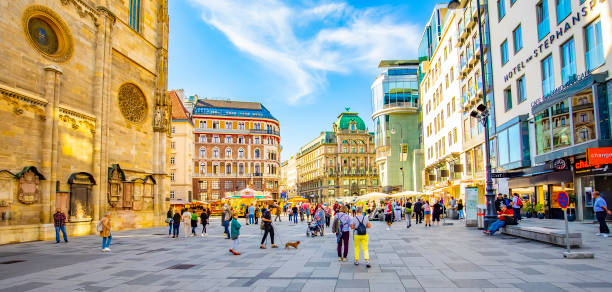 Panorama of Stephansplatz Square in Vienna, Austria Vienna, Austria - 11 May, 2022: Panoramic view of Stephansplatz Square in Wien old town, people walking on a street. st. stephens cathedral vienna photos stock pictures, royalty-free photos & images