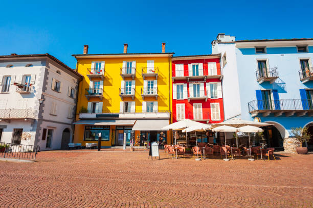 Street cafe and colorful houses in Ascona, located near Locarno town on the shore of Lake Maggiore in the Ticino canton in Switzerland.
