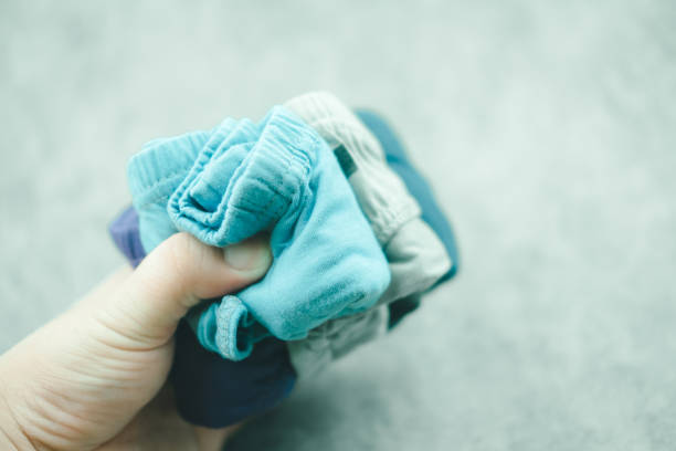 istock Hand holding new men underwear 1402459629