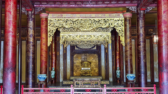 Hue, Vietnam - March 15, 2021: Inside View Of Thai Hoa Palace With Kings’ Throne In Hue Imperial Citadel. Thai Hoa Palace Was A Symbol Of The Nguyen Dynasty, The Last Dynasty Of Vietnam.