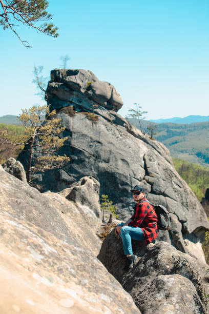 istock man hiker with backpack at dovbush rocks 1402464438