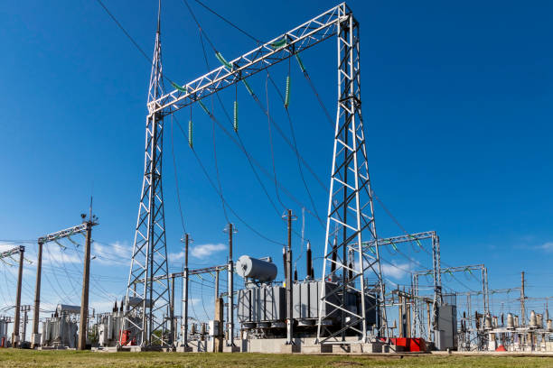 istock High voltage power transformer substation against the blue sky. 1402467836