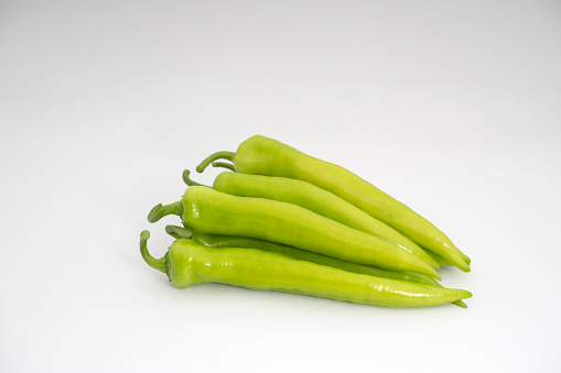 Green peppers on  white background