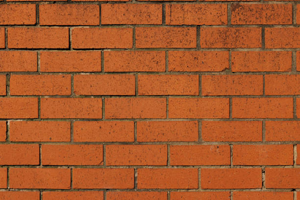 istock Section of an old orange brick wall 1402471392