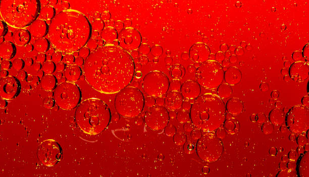 istock macro drink bubbles,red macro bubbles,Backgrounds, Abstract Backgrounds, Soda, Red, Carbonated,Beauty concept background. Closeup cosmetic liquid gel with bubbles on red colors background 1402474204