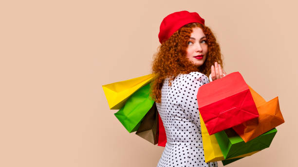 istock Woman with paper shopper package 1402475252