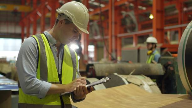 istock Industrial factory and manufacturing concept. Engineering or worker working for production of goods. 1402476716