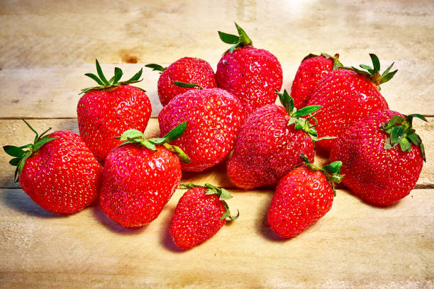 istock Fresh ripe organic strawberries on a wooden background 1402476729