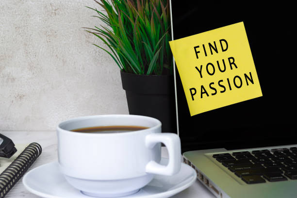 Inspirational quote - Find your passion text on sticky note on a computer screen stock photo
