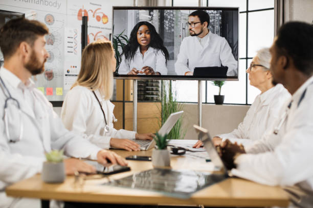 istock Therapists having online session with diverse colleagues 1402479565