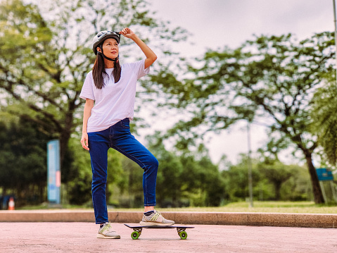 wide shot of skater jumping up from ground