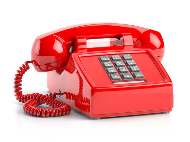 Red telephone. Vintage retro push button telephone isolated on white. stock photo