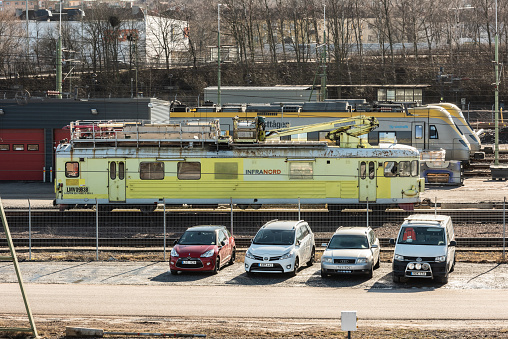 Gothenburg, Sweden - February 27 2022: Yellow InfraNord maintenance train at a depot.