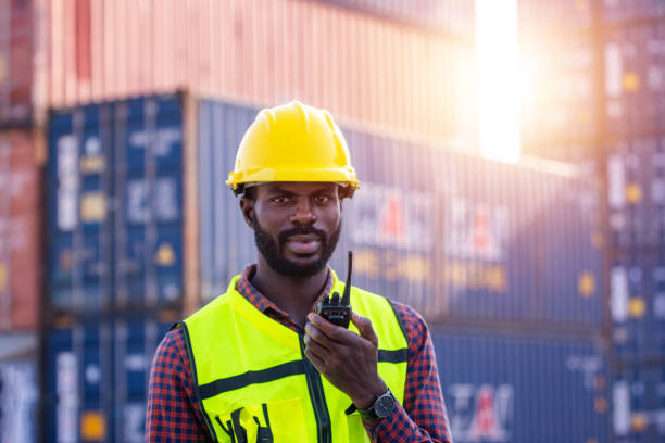 istock African American worker working in containers control station shipment import export 1402486578