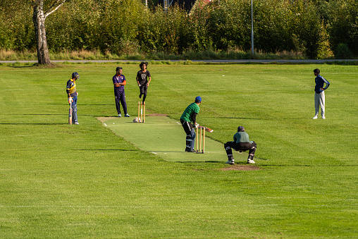 Gothenburg, Sweden - september 26 2021: Playing a game of cricket at Kviberg.