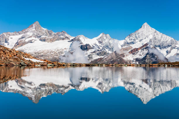 Riffelsee lake and Matterhorn mountain in the Alps, located between Switzerland and Italy